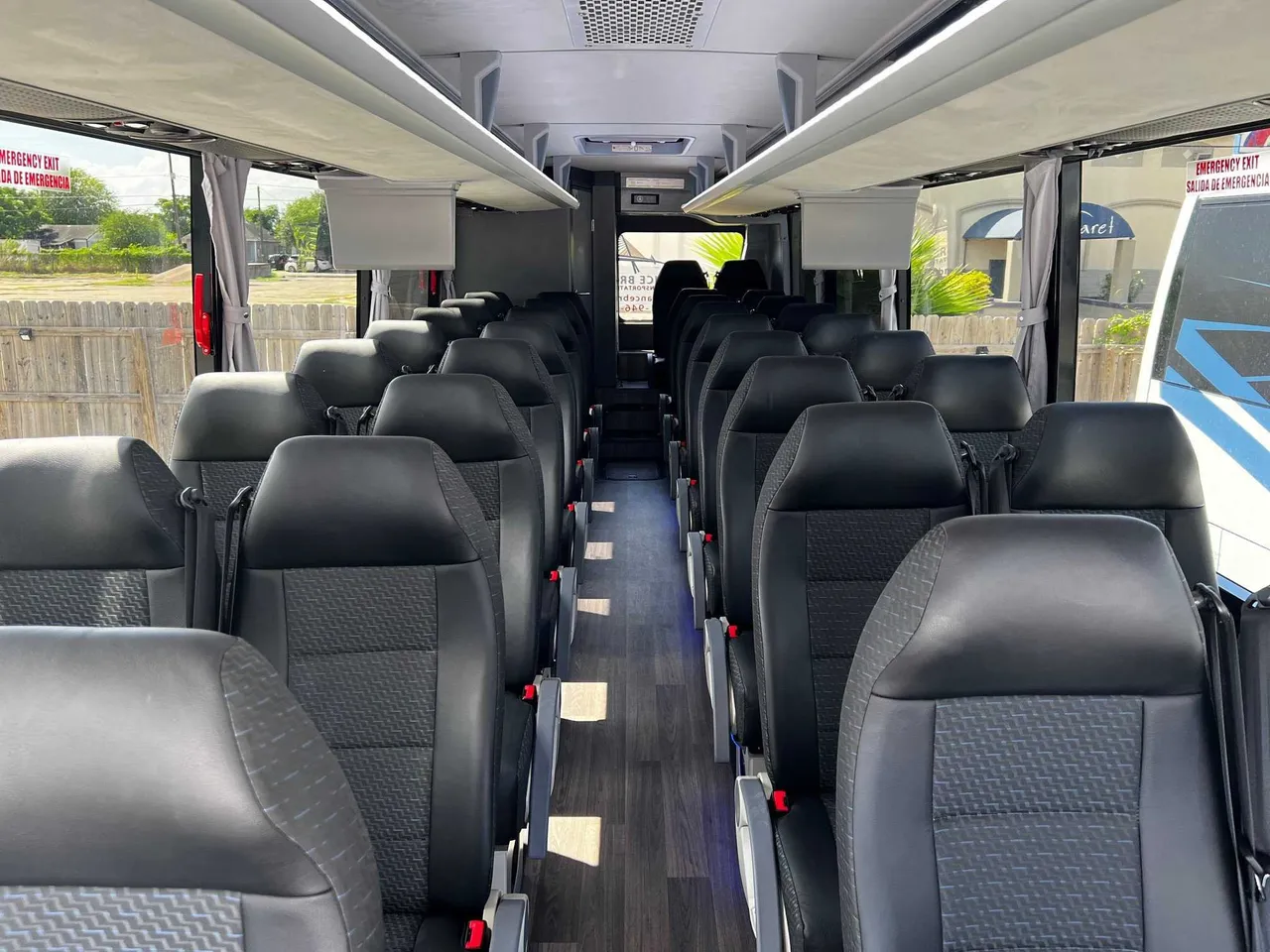 34 Passenger Charter Bus cabin – window shades and overhead parcel racks 34 Passenger Charter Bus cabin – window shades and overhead parcel racks